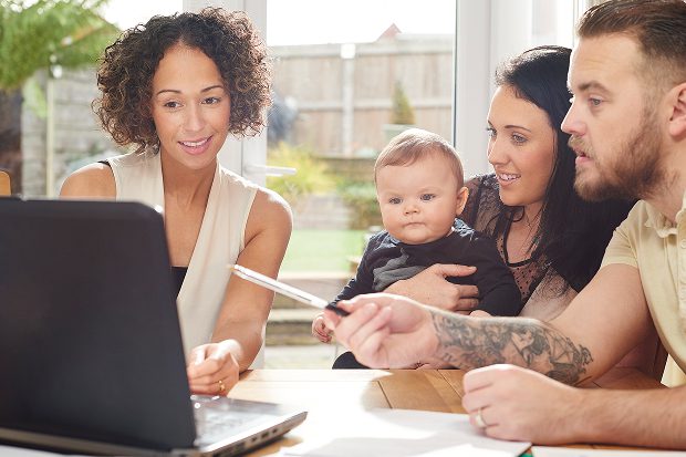 female paralegal working with a young family on their case