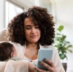 mom looking at her cell phone